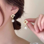 Gold Knot Pearl Drop Earrings - Image 2