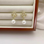 Gold Knot Pearl Drop Earrings - Image 3
